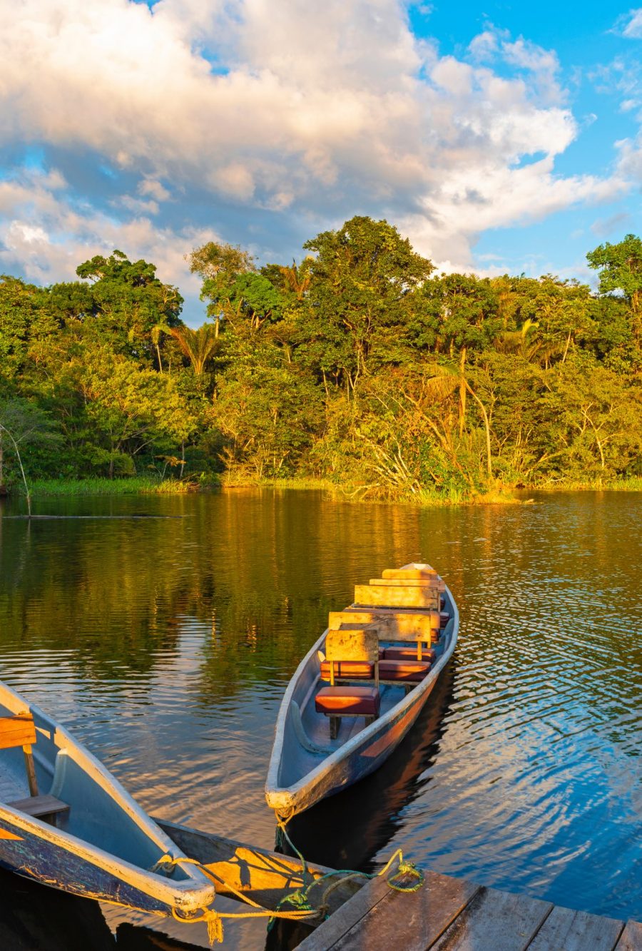 Two,Traditional,Wooden,Canoes,At,Sunset,In,The,Amazon,River