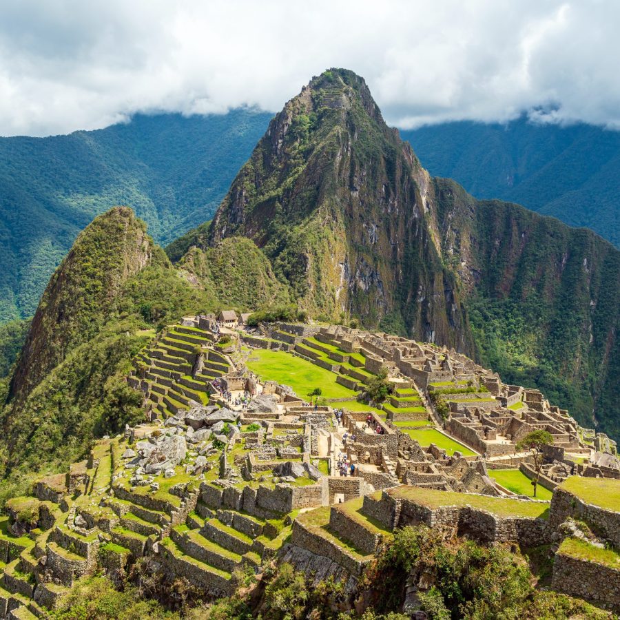 Machu,Picchu,Inca,Ruins,With,Dramatic,Clouds,,Cusco,,Peru.